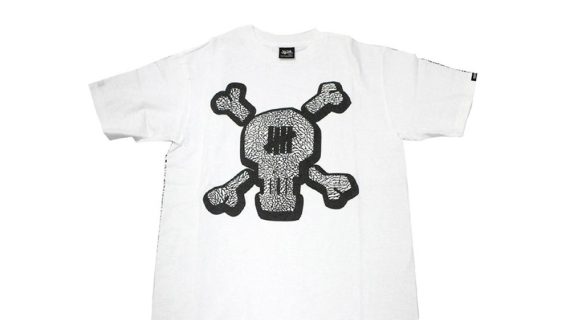 Stussy x Undefeated Cement Pattern Skull White Tee
